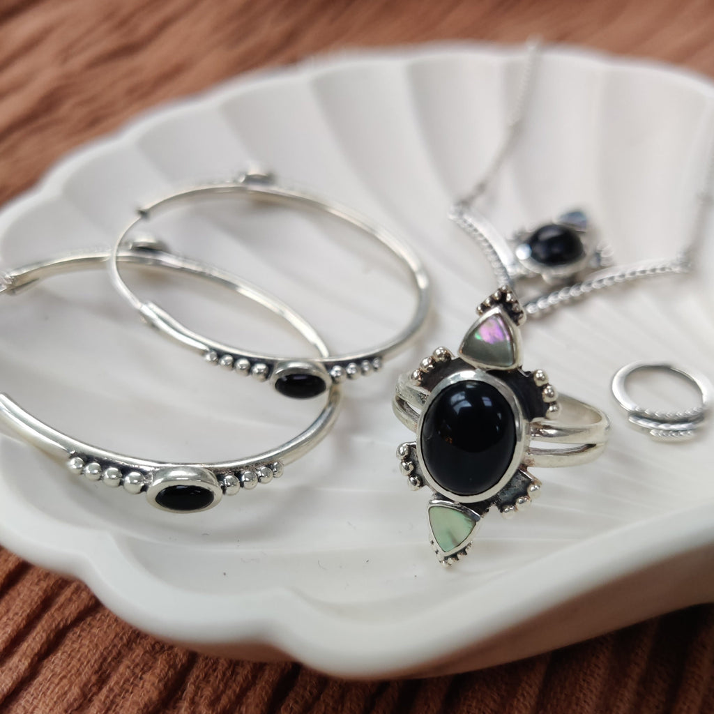 black onyx and sterling silver jewelry by noomaad, hoop earrings, necklace, ring and septum
