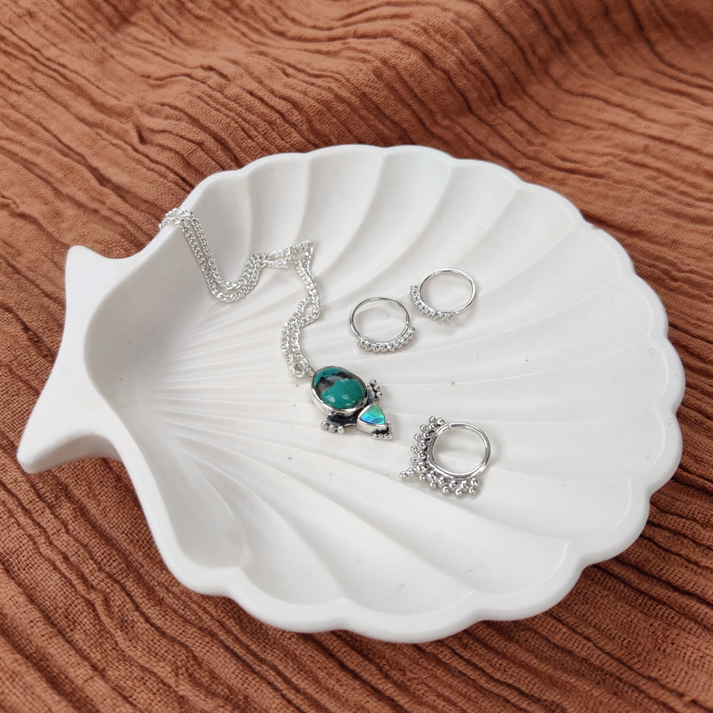 turquoise necklace, dainty hoop earrings and septum nose ring crafted from sterling silver