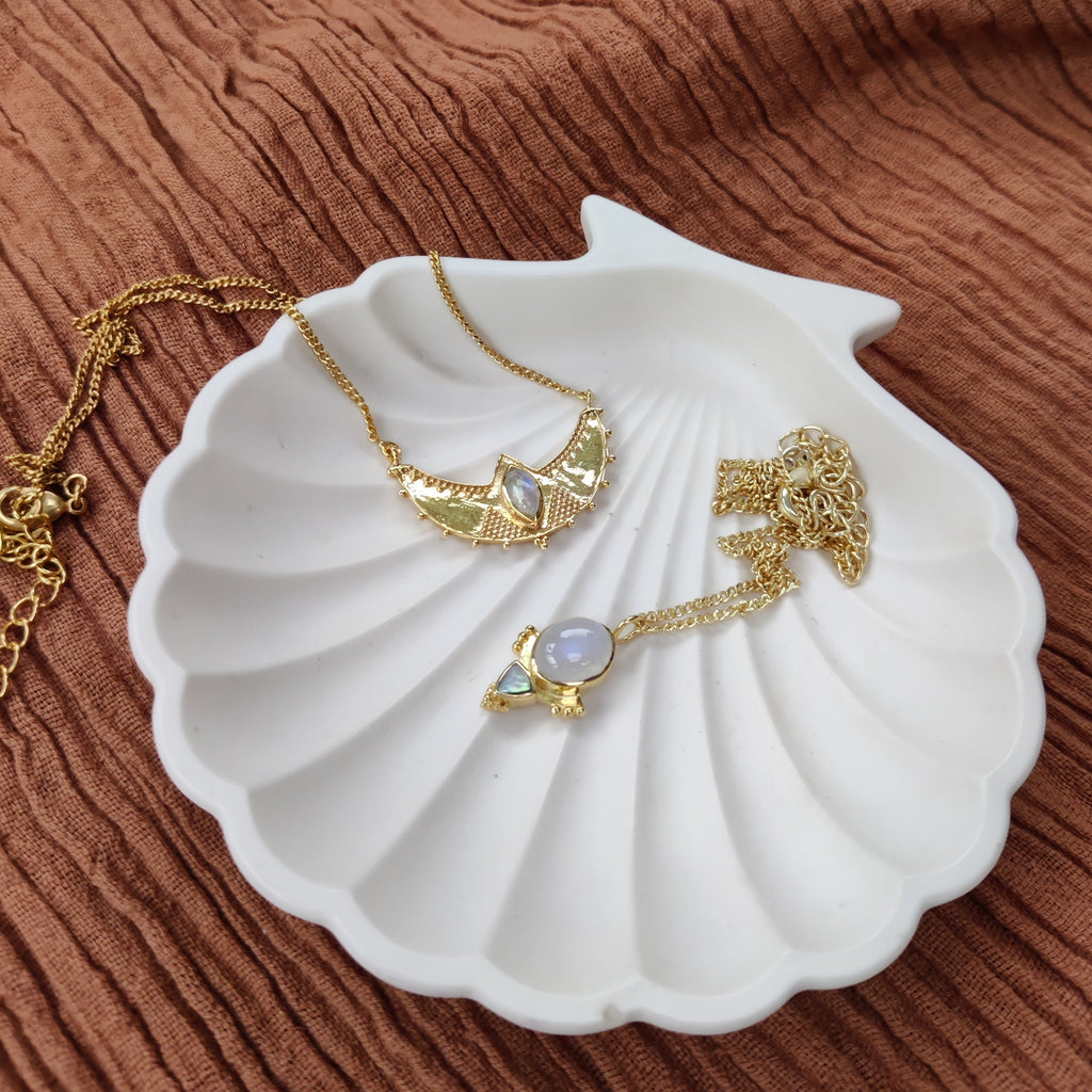 moonstone necklaces crafted from brass on shell jewelry dish