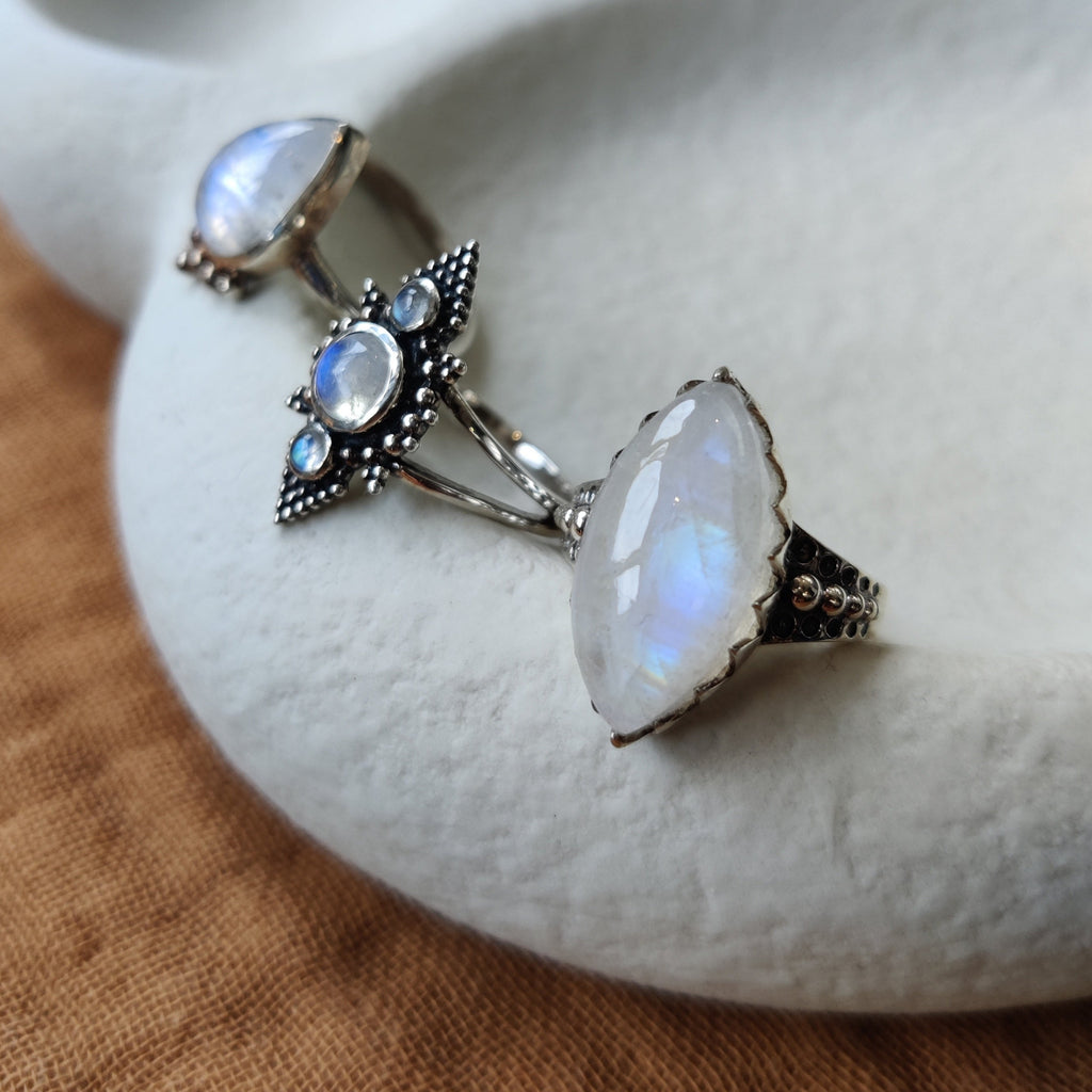 Three different ring designs with moonstone.