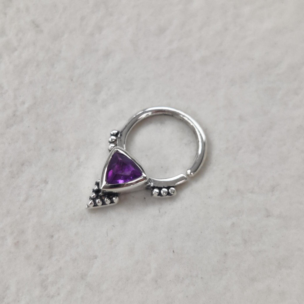 Silver septum nose ring with purple gemstone