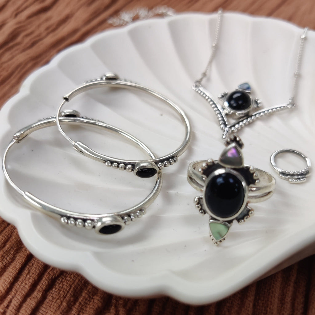 Silver hoop earrings, necklace and ring with black onyx.