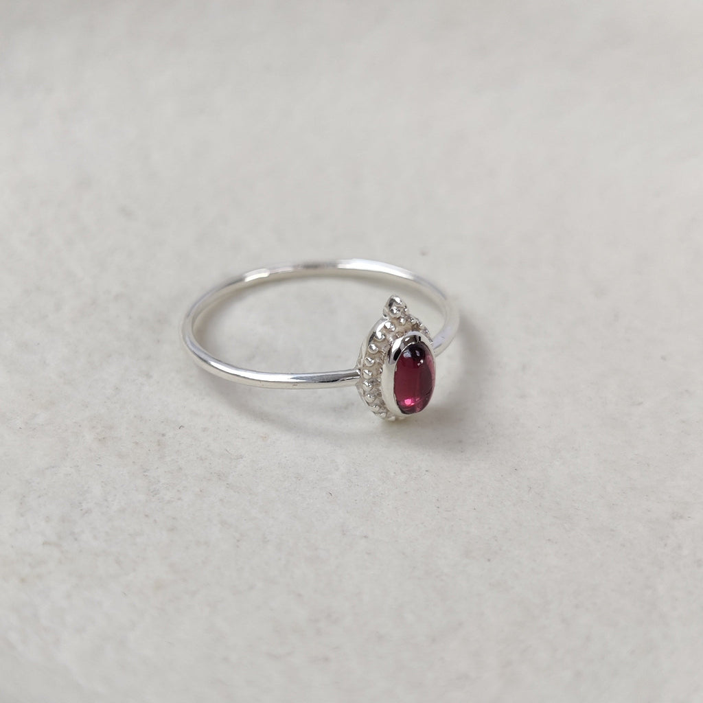Small silver ring with garnet