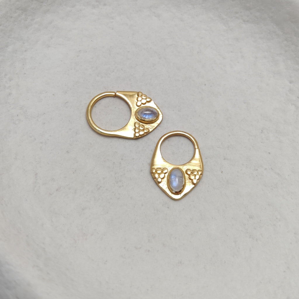 Gold septum jewelry with moonstone, displayed side by side, comparing the difference between 8mm and 10mm diameters.