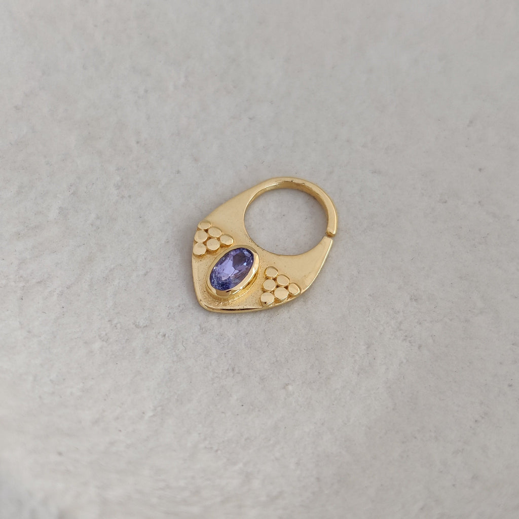 Gold septum nose ring with tanzanite gemstone