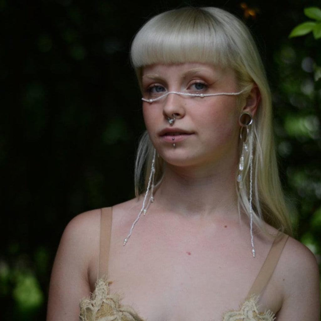 long cascade earrings on model, festival style with face chain, septum nose ring and earrings