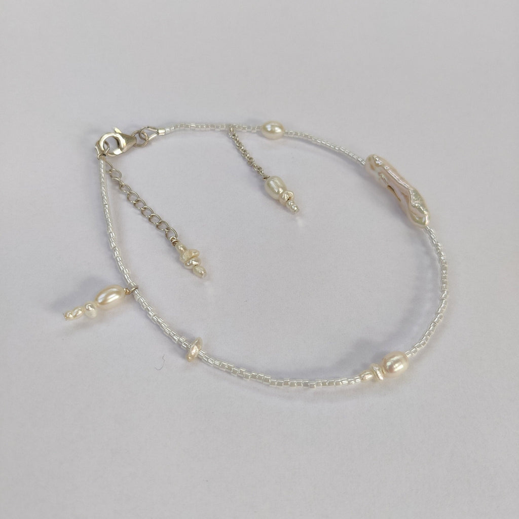 beaded anklet with freshwater pearls and glass beads, sterling silver and charms