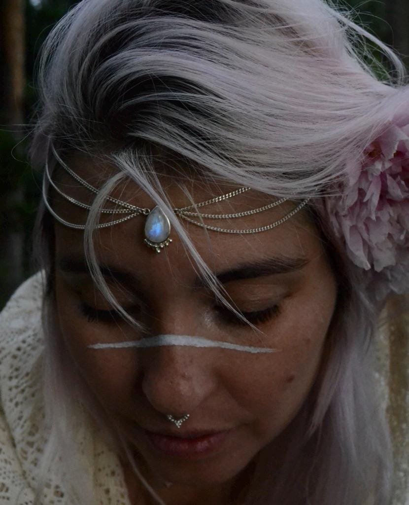 model wearing ahead chain with moonstone and three cascading chains