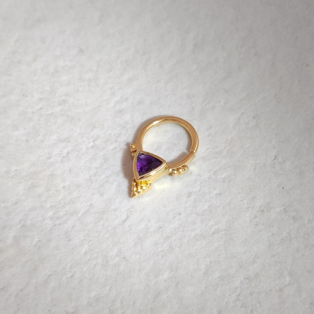Gold septum jewelry with purple amethyst gemstone