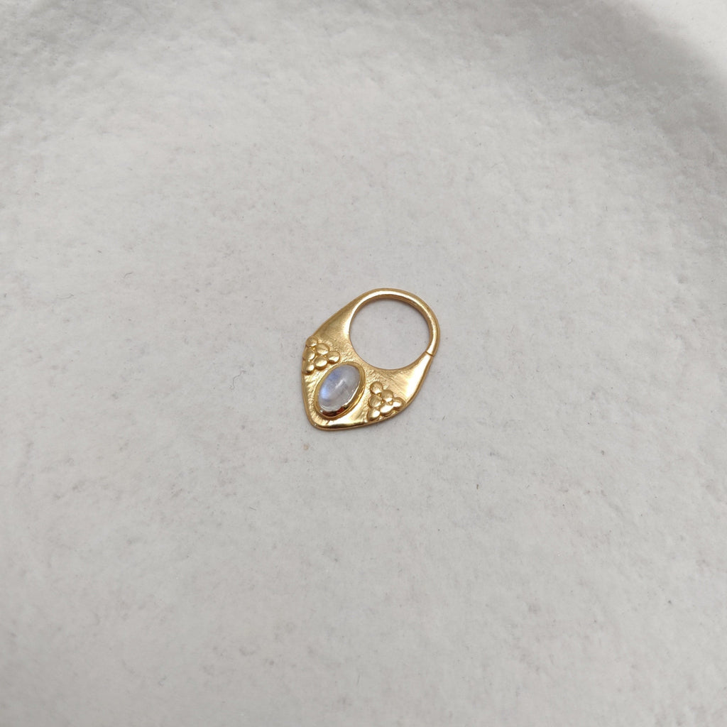 Gold septum nose ring with moonstone.