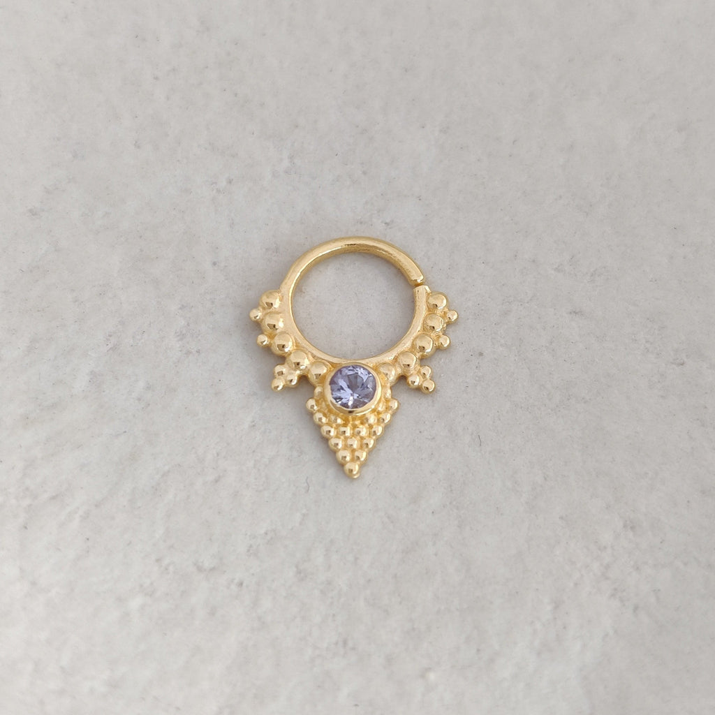 Triangle shaped gold septum nose ring with tanzanite gemstone