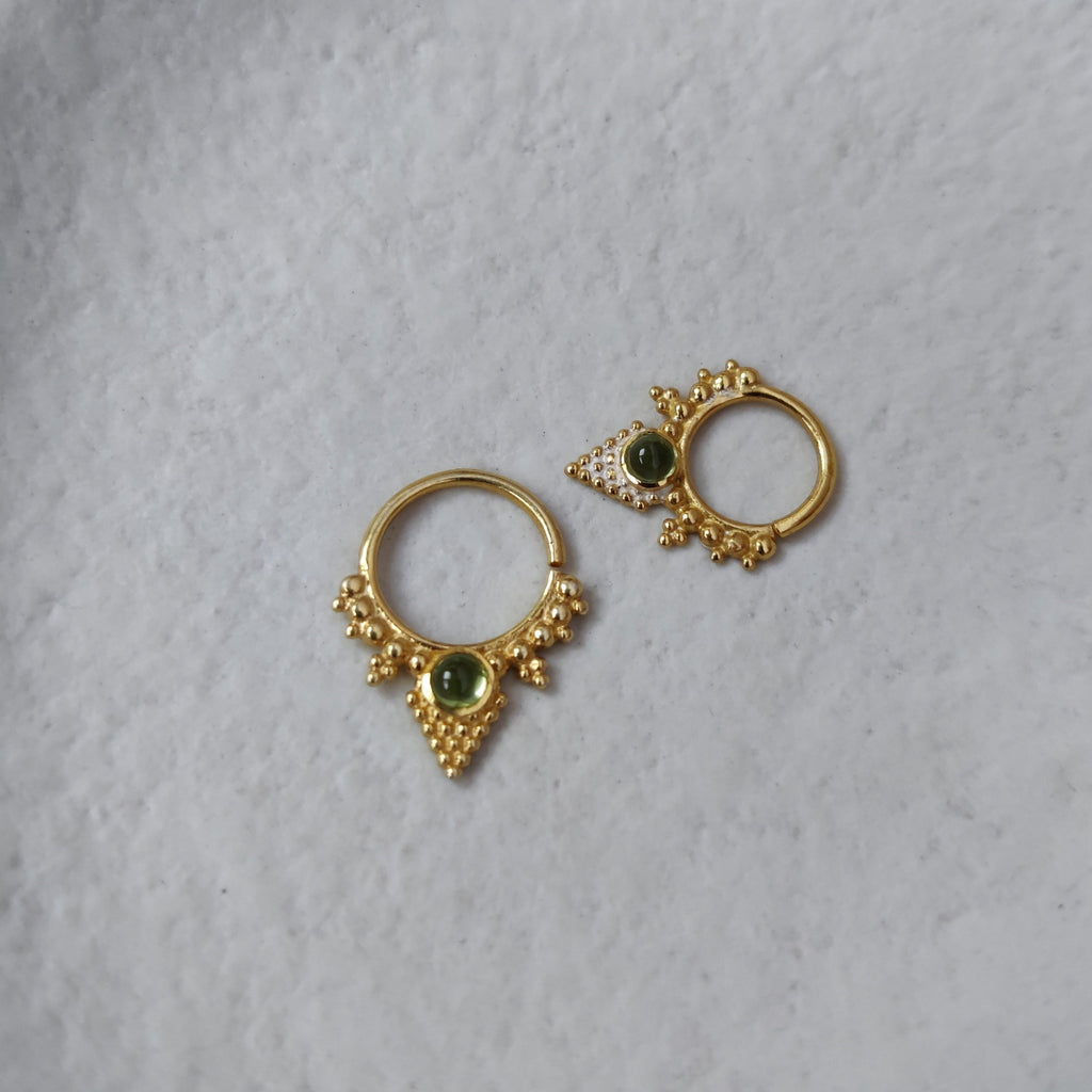 gold septum nose ring with green gemstone