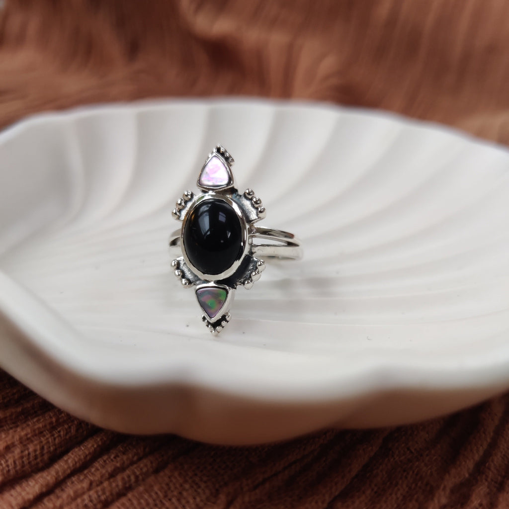 Three stone silver ring with onyx and abalone shell on a double band.