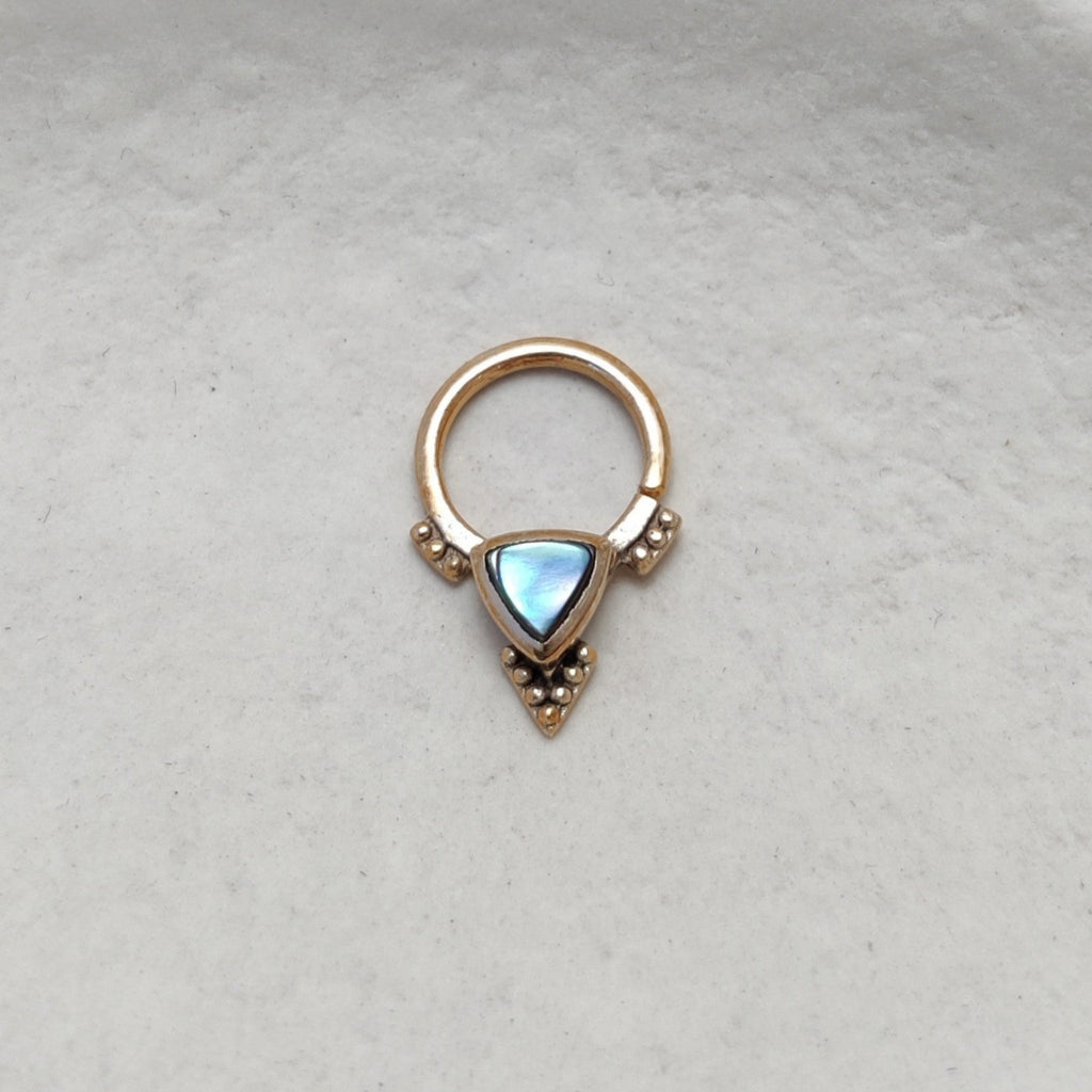 Gold septum with abalone shell, displayed from the front.