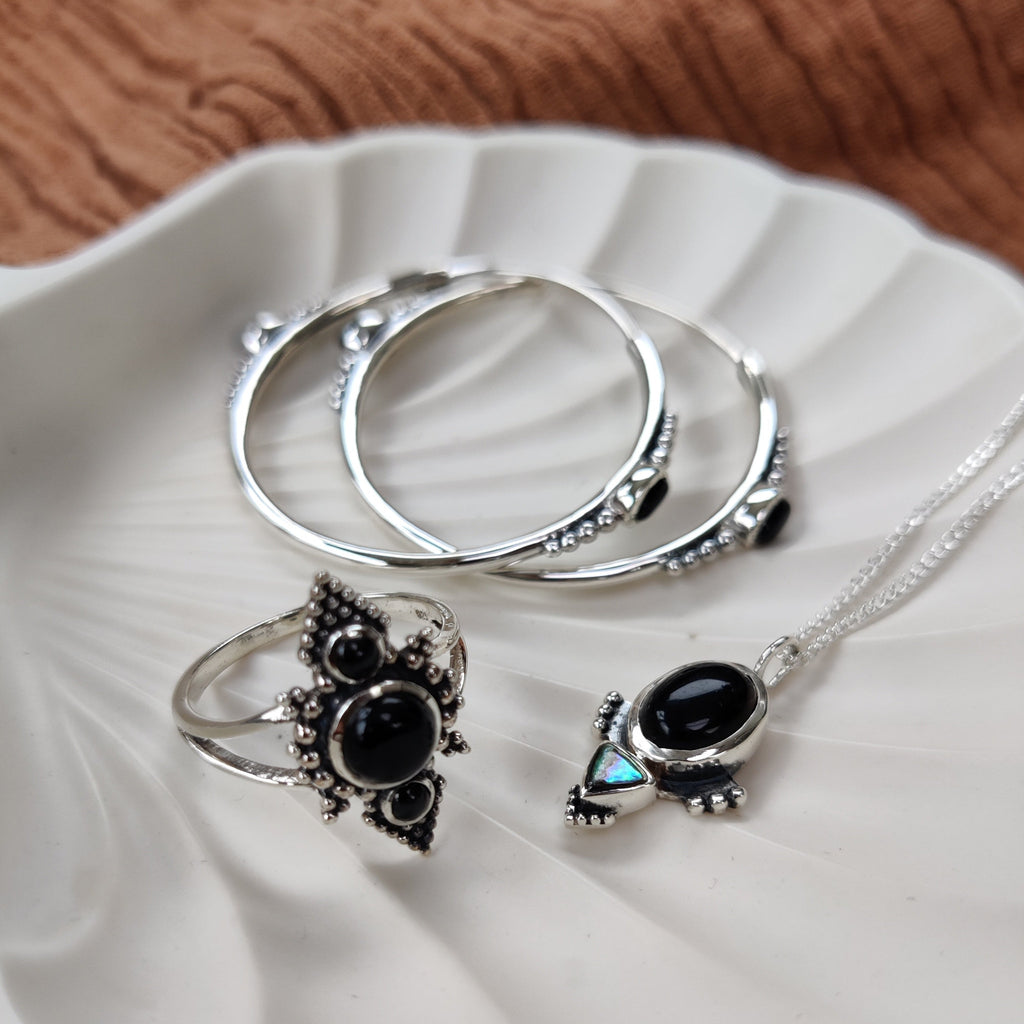 hoop earrings, onyx ring and necklace crafted from sterling silver design by noomaad