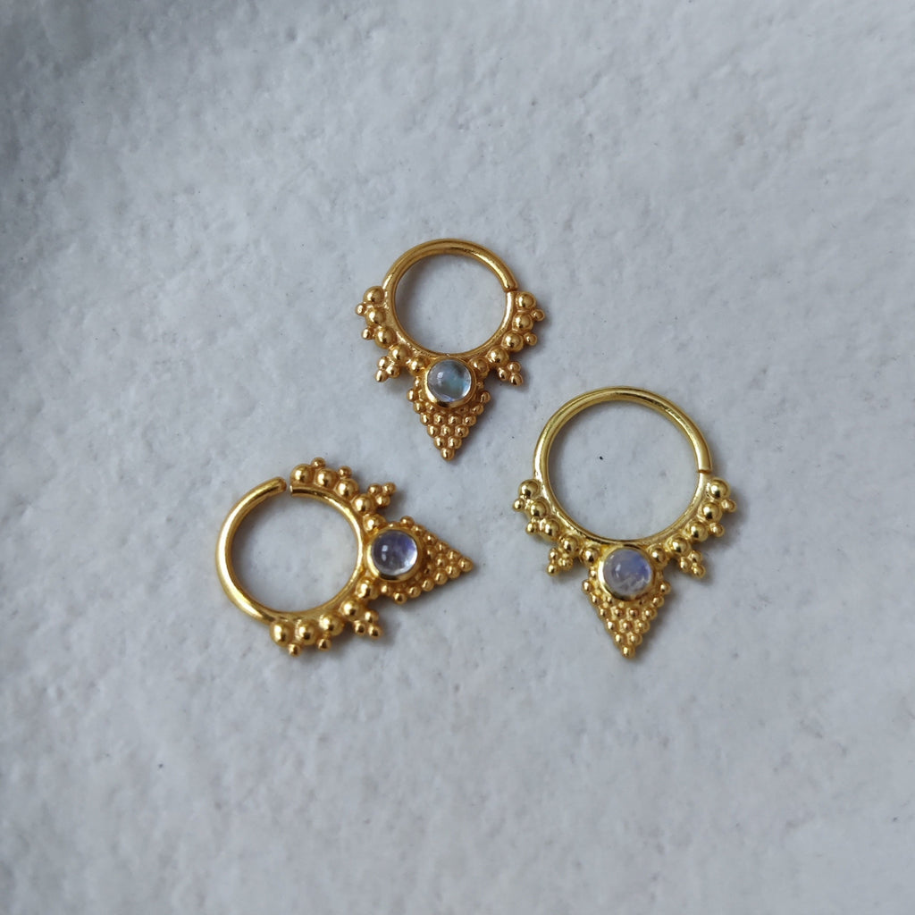 V-shaped gold septum jewelry for pierced nose. Inspired by ancient jewelry, with dotted details and a moonstone centerpiece.