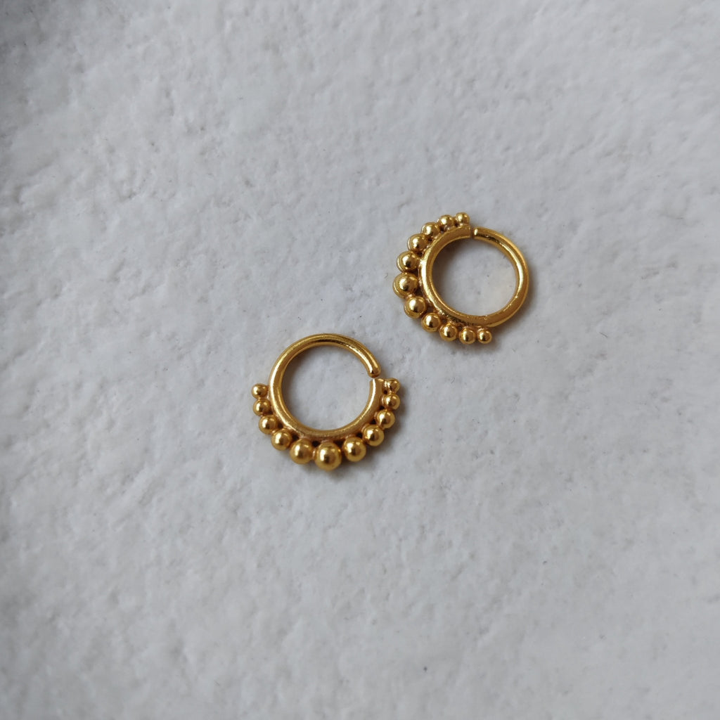 septum nose ring, gold, front and side angle.