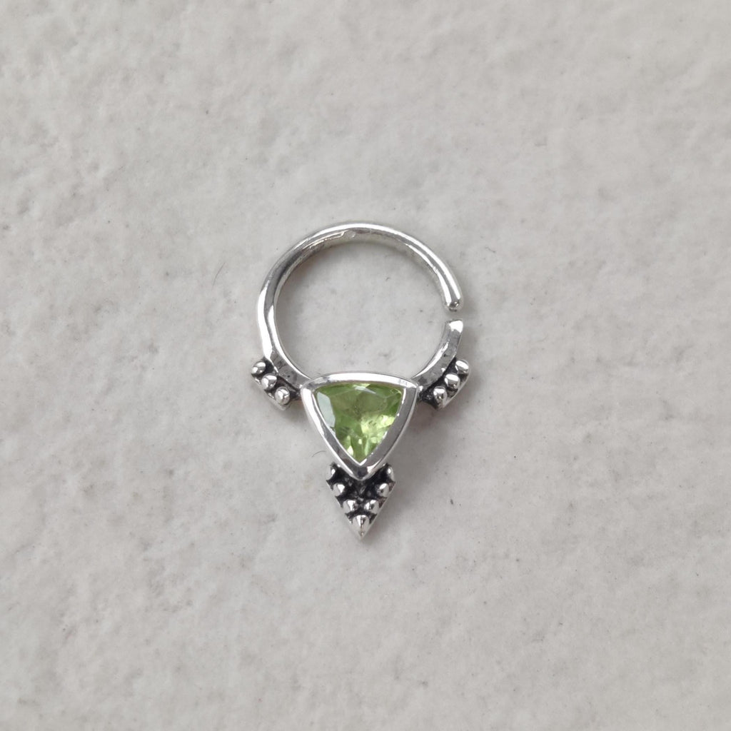Bohemian silver septum nose ring with a triangle shaped peridot gemstone