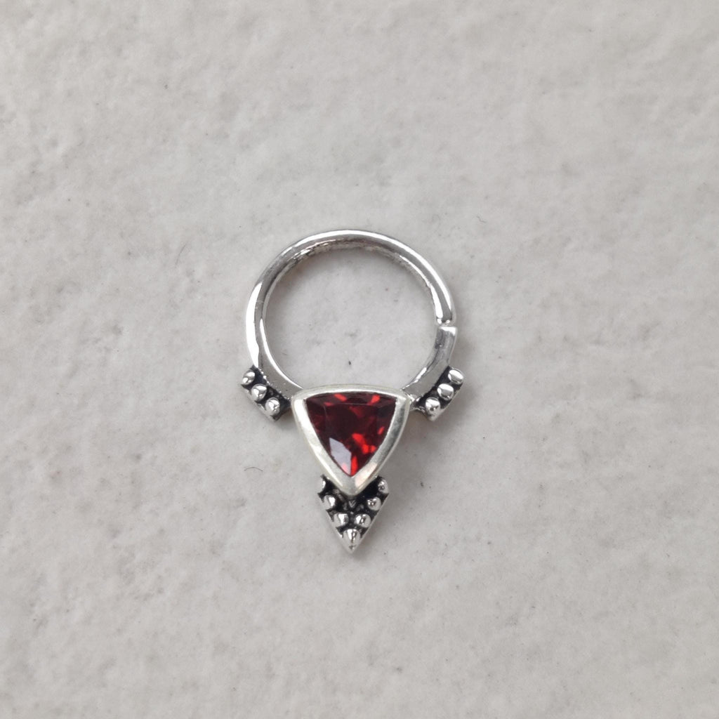 Silver septum nose ring with a triangle shaped red garnet gemstone
