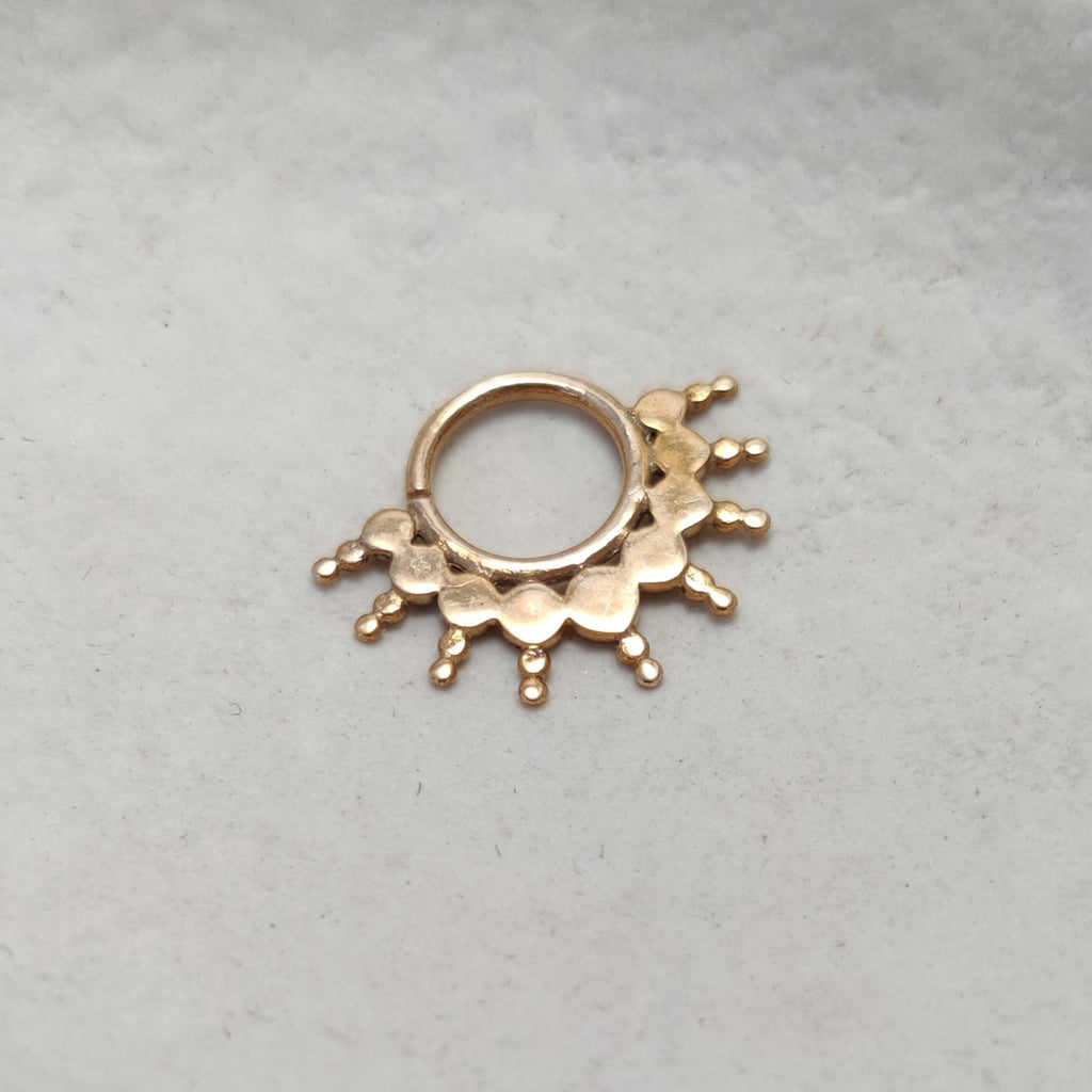 Solid 9k gold septum, displayed on a white background.