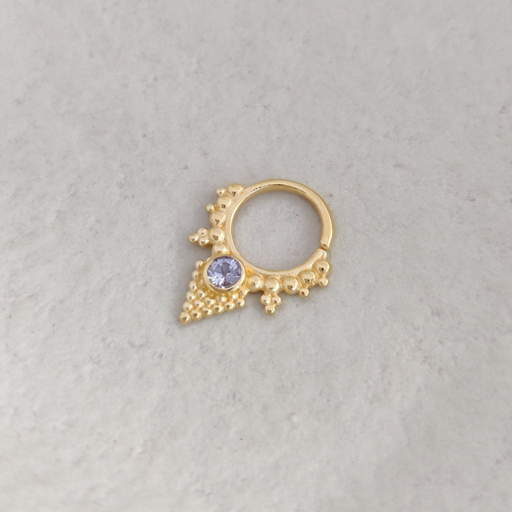 Gold septum nose ring with tanzanite