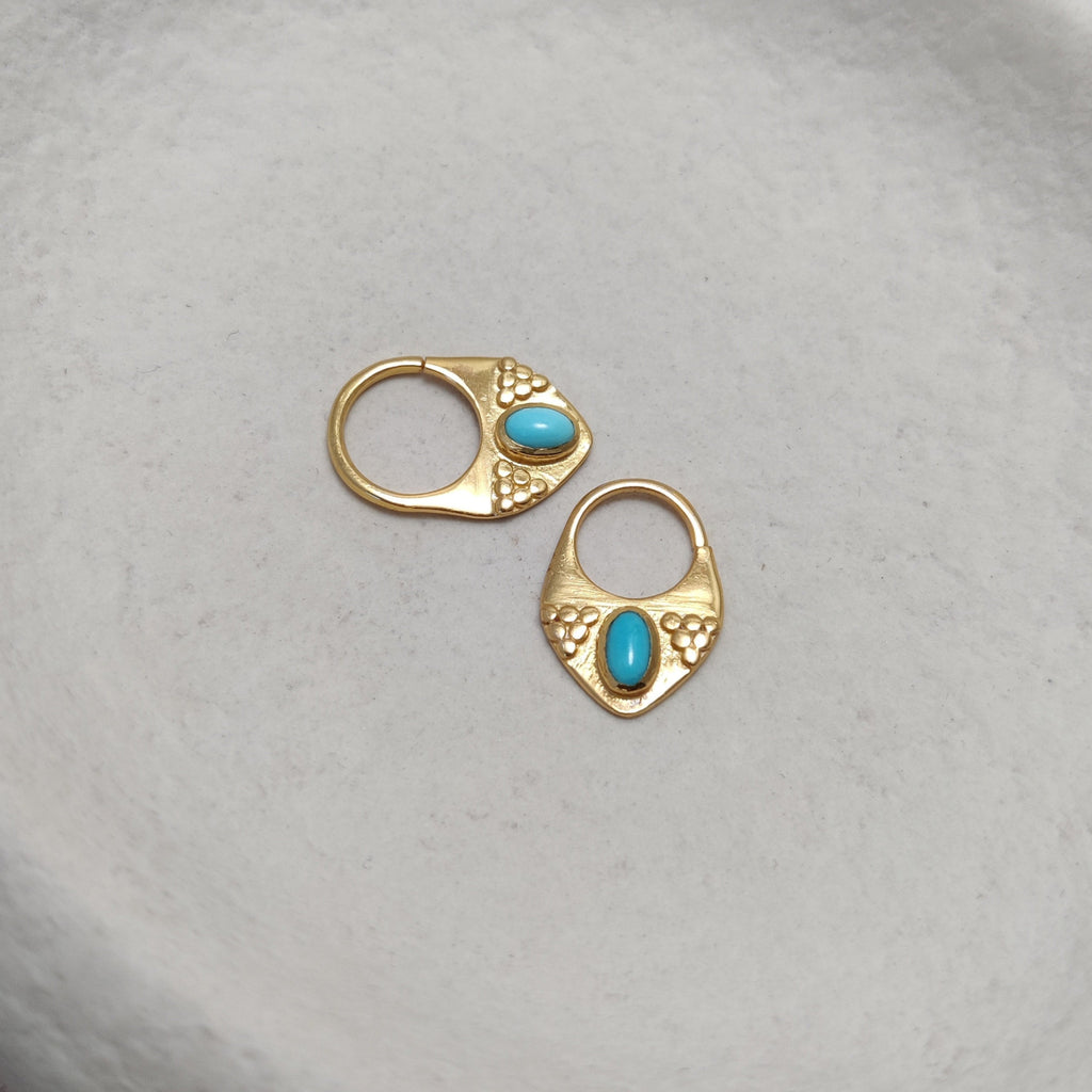 Gold septum jewelry with turquoise displayed side by side, comparing the difference between 8mm and 10mm diameters.