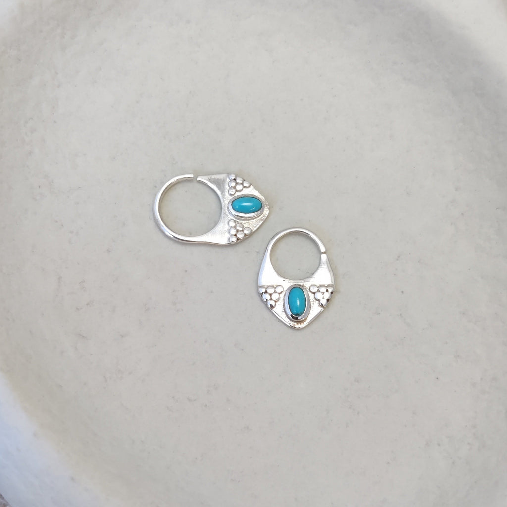 Silver septum jewelry with turquoise, displayed side by side, comparing the difference between 8mm and 10mm diameters.