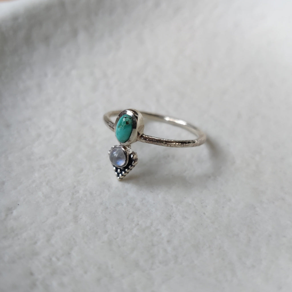 small silver ring with turquoise and moonstone.