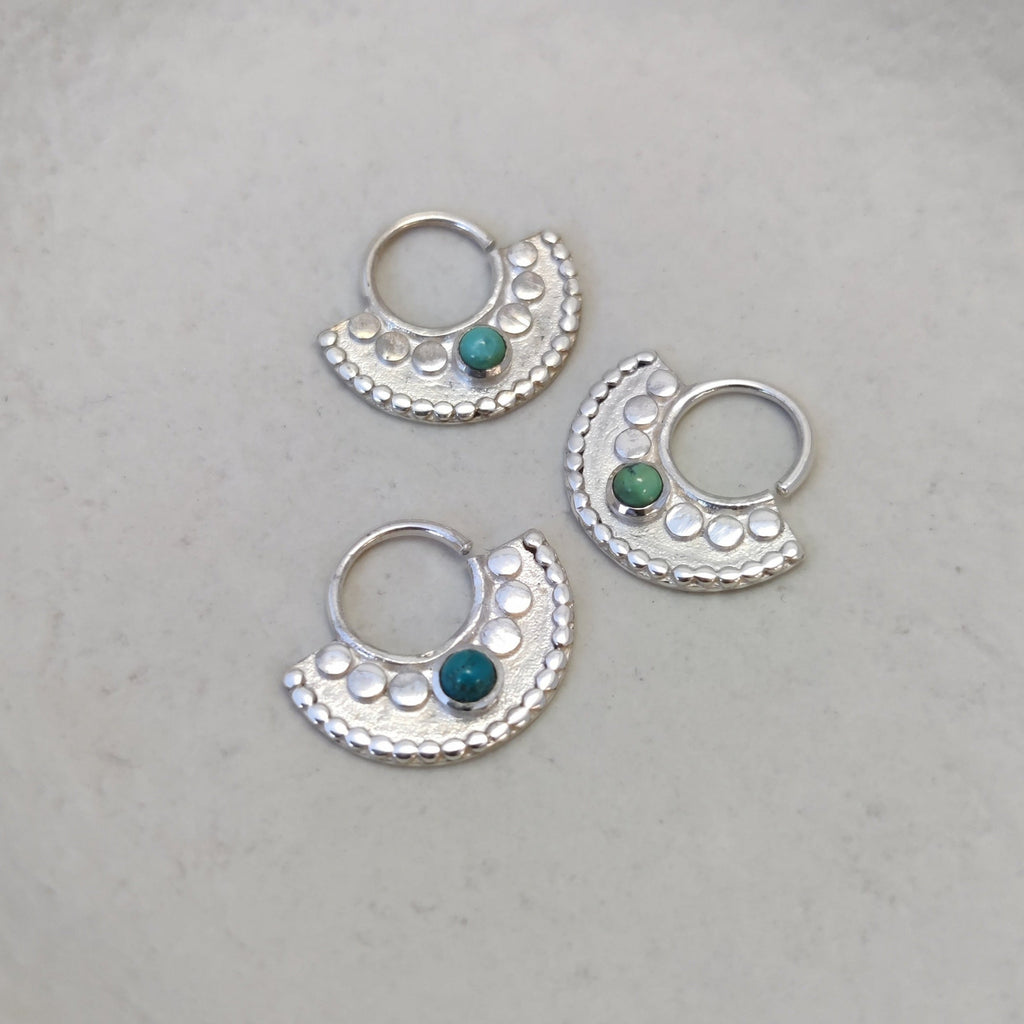 Three large silver septum jewelry with turquoise.