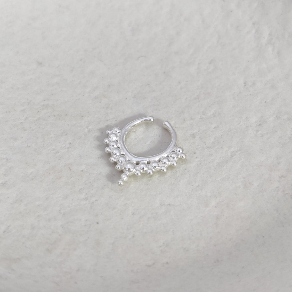 Fake septum nose ring from silver, displayed on a light background.