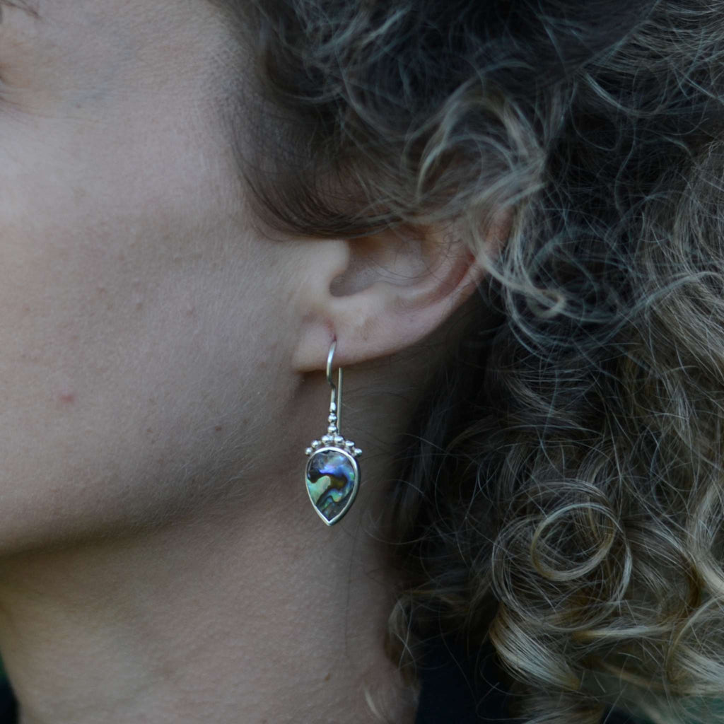 Silver drop earring with abalone shell.