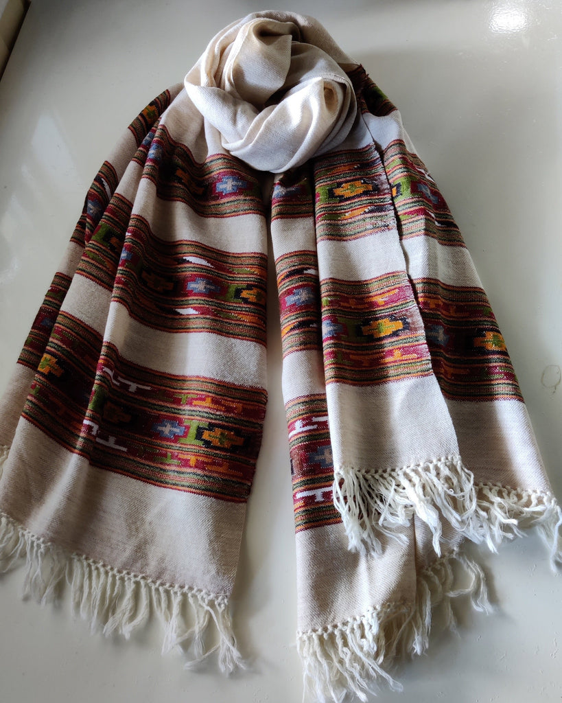Wool shawl beige with patterns.